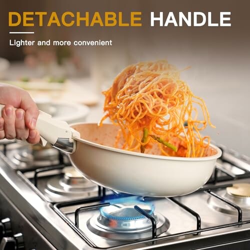 Person cooking noodles in pan with detachable handle on stove.