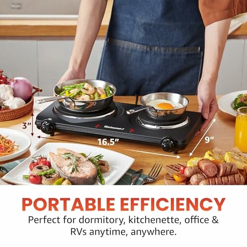 Person using a portable electric burner with food on a kitchen counter.
