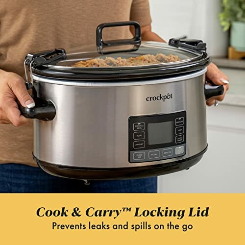 Person holding a Crockpot with Cook & Carry locking lid.